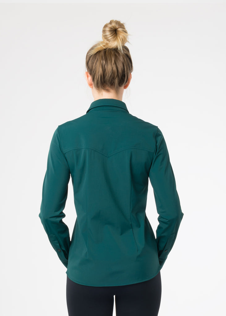 Female model photographed from the back wearing a dark green shirt